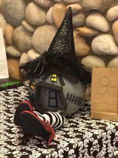 a table topped with halloween decorations and paper bags