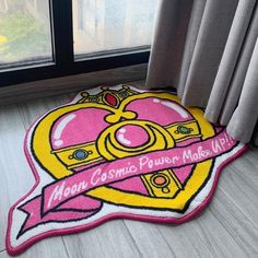 a pink and yellow rug with the words mom cosmic power model life on it