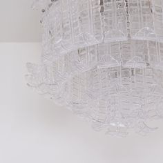 a glass chandelier hanging from the ceiling