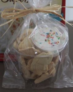 a plastic bag filled with cookies and sprinkles on top of a table