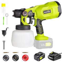 a green and black electric drill with tools