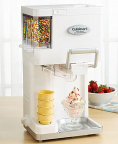 an ice cream dispenser filled with lots of toppings