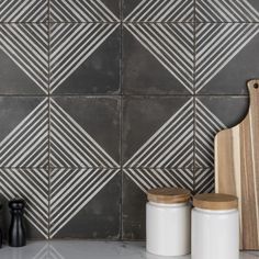 the kitchen counter is clean and ready to be used as a cutting board, cheese grater, and other items