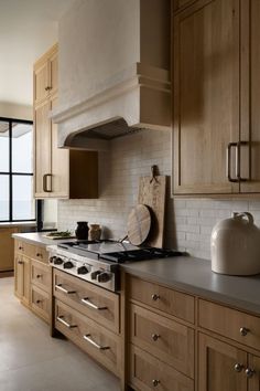 a kitchen with wooden cabinets and an oven