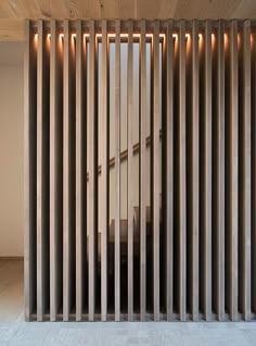 a room with wooden slats on the wall