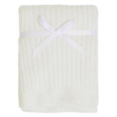 a white blanket with a bow on it