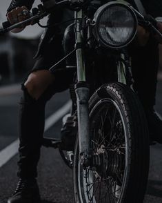 a man riding on the back of a motorcycle