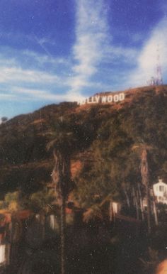 the hollywood sign is on top of a hill