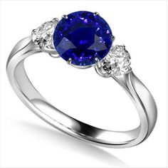 METAL SPECIFICATIONS White Gold 14K STONE SPECIFICATIONS Stone Name : Blue Sapphire and Diamond Stone Cut : Round Stone Details : There is one round cut sapphire approx. 2 carats (Approx. Dia 7.5 mm) and two round diamonds approx. 0.12 carats each (Approx. Dia. 2.9 mm) on the sides. Natural earth mined stones. Color : F Clarity : VS1 Quality of Sapphire : AAA Total : Approx. 2.25 Carats RING SPECIFICATIONS Size : 6.5 (Can ship in any size, please send us a message about size after placing the or Cheap Gemstone Rings, Mens Wedding Rings Vintage, Engagement Rings Uk, Blue Sapphire Diamond Ring, Vintage Style Engagement Rings, Trilogy Ring, Blue Sapphire Ring, Sapphire Engagement Ring Blue, Blue Sapphire Diamond