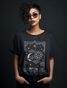 Unleash your inner power with the Sun and Moon Shirt. Designed for witchy souls and modern mystics, this shirt is crafted from 100% breathable cotton, flawlessly merging witchcraft aesthetics with contemporary comfort. Elevate your everyday style and embrace your spiritual journey with this unique addition to your wardrobe staples.Choose from a variety of plus sizes up to 3XL for a roomy fit, or size up for an oversized look.Surprise any of your witchy friends with a gift they would love! Breath Black Bohemian Tops For Halloween, Black Bohemian Top For Halloween, Black Bohemian Top For Alternative Fashion, Black Bohemian Relaxed Fit Shirt, Black Bohemian Shirt For Festival, Black Moon Print Top For Festivals, Mystical Black Top With Graphic Print, Mystical Black Tops With Graphic Print, Witchy Friends