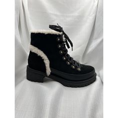 Elevate Your Shoe Collection With These Stylish Winter Combat Boots By Tory Burch. The Sleek Black Color And Almond Toe Shape Will Keep Your Feet Warm. The Lace-Up Closure Ensures A Comfortable Fit While The Low Block Heel Adds A Touch Of Sophistication. These Boots Feature Shearling Lining And Are Made From High-Quality Black Suede Material, Giving You Both Comfort And Style. The Ankle-Length Shaft And Modern Theme Add A Trendy Touch To These Boots. Available In Us Size 8, These Boots Are A Must-Have For Any Fashion-Forward Woman. Black Lug Boots, Winter Combat Boots, Black Boots With Faux Fur Trim And Round Toe, Luxury Lace-up Ankle Boots With Lug Sole, Black Faux Fur Boots With Trim, Black High-top Boots With Faux Fur Lining, Black Shearling Boots With Faux Fur Trim, Lug Boots, Low Block Heels