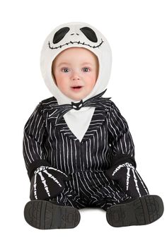 a baby in a jack skelling costume sitting on the ground with his eyes closed