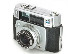 an old fashioned camera on a white background