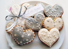 some heart shaped cookies are on a plate