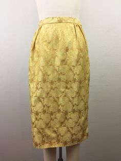 "Fab 1950s-early 60s gold floral brocade top and skirt set. Boxy style top buttons in back and has front bow detail. Pencil skirt zips at the side. No label, but fits like an XS. Condition - noticed a small mark at shoulder and skirt has a couple places where seam has come loose (see pics). Otherwise great! TOP Shoulders - 15.5\" Bust - 37\" Waist - 36\" Length - 19\" Sleeves - 16\" SKIRT Waist - 25\" Hip - 36\" Length - 26.5\" Follow us on Instagram@flashbackvtg !" Gold Skirt For Spring Formal Occasion, Elegant Yellow Skirt For Wedding, Elegant Full Skirt In Gold, Elegant Gold Full Skirt, Vintage Formal Skirt, Elegant Gold Cocktail Skirt, Brocade Top, Teal Blazer, Early 60s