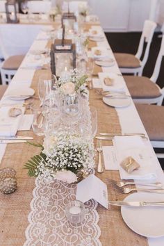 a long table set with place settings and silverware for guests to sit down at