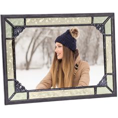 a woman with long hair wearing a winter hat