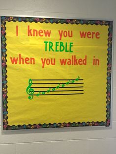 a bulletin board on the wall in a school hallway that says, i knew you were treble when you walked in