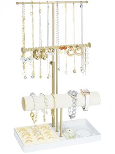 a jewelry rack with bracelets and rings on it