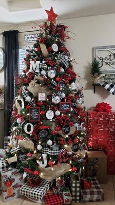 a christmas tree decorated with red, white and black ornaments