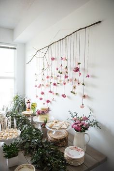 a room with flowers hanging from the wall