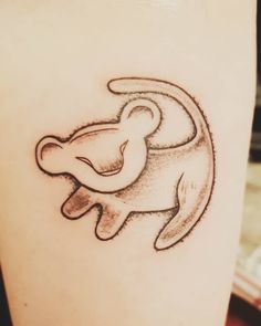 a small tattoo on the leg of a person's arm with an elephant design