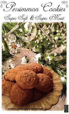 some cookies are on a plate next to a christmas tree