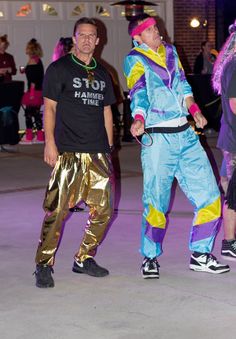 two men in colorful costumes standing next to each other