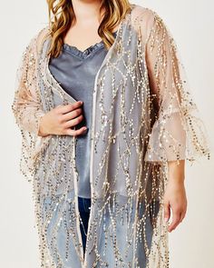 Instant outfit: Top your skinny jeans and heels with this plus size kimono Glamorous Sequin Fabric For Festive Fall Occasions, Glamorous Contrast Sequin Fabric For Spring, Glamorous Spring Sequin Fabric With Contrast Sequins, Shimmer Sequin Fabric For Spring Evening, Spring Evening Shimmer Sequin Fabric, Spring Evening Sequin Fabric With Shimmer, Glamorous Shimmer Sequin Fabric For Spring, Spring Sequin Fabric For Night Out, Glamorous Sequin Fabric For Festive Spring Occasions