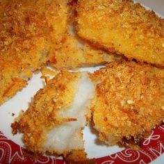 some fried food on a red and white plate