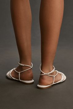 Leather upper, insole Rubber sole Clasp styling Imported | Strappy Flat Sandals by Anthropologie in White, Women's, Size: 6, Leather/Rubber Strappy Sandals Flat, Strappy Flats, 50 Fashion, Shop Swimwear, Shoe Shop, Flat Sandals, Rubber Sole, Gifts For Mom, Leather Upper