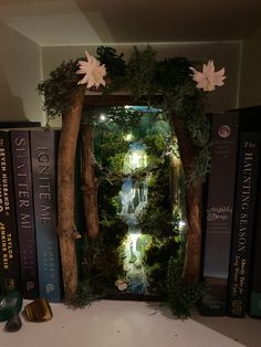 a book shelf filled with books and fake trees