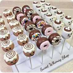 chocolate covered donuts with sprinkles and marshmallows on sticks