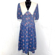 This Vintage 80s Gunne Sax Brand By Jessica Mcclintock Dress Is A Vintage Collectors Dream. Perfect Condition, Only Cream Collar Would Need Ironing. For Wrinkles! Featuring Button Down Front, Shoulder Pads, Lace-Lined Collared Neckline, Puffed Sleeve And Pockets! Gorgeous Dark Blue With Pink Roses Design On The Front And Back. Stunning Structured Fit With Flattering Waistline. 100% Cotton, Size 9 (Which Is Between And 8 And 10 In Women's) Amazing Dress! Make Me An Offer! #Cottagecore #Cottage #C Gunne Sax Prairie Dress, Cottage Coquette, 1970s Gunne Sax Dress, Gunne Sax Dress Vintage 80s, Jessica Mcclintock Gunne Sax Dress, Pink Gunne Sax Dress, Jessica Mcclintock Dress, Cottagecore Cottage, Roses Design