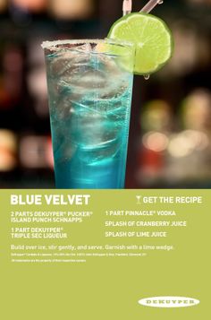 a blue velvet drink with a lime slice on top