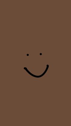 a brown background with a smiley face drawn on it