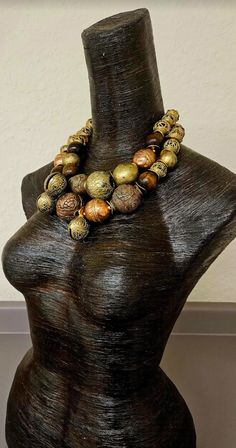 Look at how stunning this African oversized beaded tribal statement necklace is! The components include Yoruba brass beads (with imperfections), Ethiopian copper beads, a Tibetan copper repousse accent bead, chocolate brown round wood beads, burnished gold tone metal wavy spacers, rhinestone rondelles and African glass hand painted beads. Despite the heavy look, this is actually quite lightweight as most of the metal beads are hollow. Adjusts from 19-21" and I can add additional chain links free Artisan Bronze Beaded Necklaces With Large Beads, Bronze Artisan Beaded Necklace With Large Beads, Artisan Beaded Necklaces With Large Bronze Beads, Artisan Beaded Necklace With Large Bronze Beads, Large Bronze Bohemian Beads, Bohemian Large Bronze Beads, Bronze Bohemian Necklace With Large Beads, Bohemian Bronze Necklace With Large Beads, Bronze Bohemian Beaded Necklace With Wooden Beads