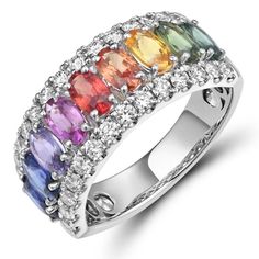 A dazzling, mystifying shade Rainbow Sapphires with diamonds is in a class all by itself. This Rainbow sapphire & diamond ring is as luxurious as it gets!Metal: 18K Rose GoldRound Cut 28 Diamonds: 0.62ct t.w. Rainbow Sapphire 9 Oval- Cut Diamonds: 2.38ct t.w. Setting: Prong, Pave / Width: 9mm For desired ring size please leave us a note at the check out. Fancy Sapphire, Rainbow Sapphires, Rainbow Jewelry, White Diamond Ring, Sapphire Diamond Ring, Oval Cut Diamond, Sapphire Diamond, A Class, 18k Rose Gold