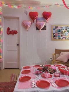 valentine's day table setting with balloons and plates