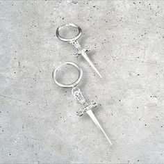 Gothic stainless steel hoop sword earrings. Charms are zinc alloy, hoops stainless steel. Metal Hoop Earrings For Streetwear, Minimalist Silver Earrings For Streetwear, Silver Stainless Steel Punk Hoop Earrings, Punk Style Silver Stainless Steel Hoop Earrings, Pierced Hoop Jewelry For Streetwear, Silver Hoop Jewelry For Streetwear, Silver Hoop Earrings For Streetwear, Earrings Gothic, Earrings Charms