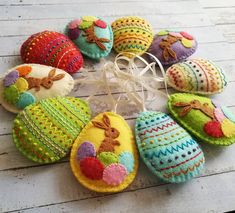 an assortment of handmade felt easter eggs