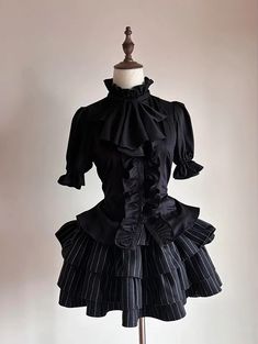 Step into the world of gothic elegance with our Black Jabot Collar Gothic Prince Style Ouji Short Sleeves Shirt. This exquisite piece features a refined jabot collar, exuding an air of aristocratic charm. The lace-up detail at the back not only adds a touch of classic sophistication but also ensures a perfect fit, accentuating your slim waist. This shirt combines the timeless allure of gothic fashion with the regal essence of prince-style attire.   	 		 			Size 			S 			M 			L 			XL 		 		 			Full Mari Core, Prince Style, Jabot Collar, Ouji Fashion, Steampunk Fashion Female, Gothic Elegance, Gothic Skirts, Short Sleeves Shirt, Vibe Clothes