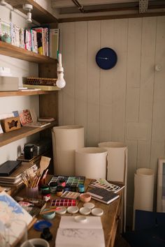 a desk with lots of crafting supplies on it