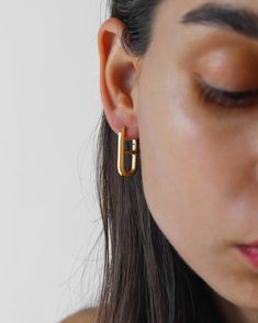 DETAILS : ▪ 18K Gold Vermeil Earrings▪ Base Metal - Solid 925 Sterling Silver▪ Hypoallergenic▪ Lightweight▪ Hoops Size - 24x13mm▪ Water Resistant▪ Shipps from Berlin▪ Orders to the US - No Customs Fees Upon the Delivery MATERIALS : ～18k gold vermeil. Do not confuse it with a regular 0.5 microns gold plating over a brass base. Gold vermeil jewelry has a solid 925 sterling silver base coated with a very thick, 2.5-micron layer of 18k gold. Simple earrings belong in every good jewelry collection! That's why we designed a stunning pair for you. These earrings are classic and are naturally lightweight. The earrings are handcrafted in vermeil, a thick 18K gold layer on solid 925 sterling silver, so you can comfortably wear them all day long with any of your outfits. Oval Gold Huggie Earrings As Gift, Oval Hallmarked Huggie Earrings Gift, Simple Gold Hoop Earrings, Gold Vermeil Jewelry, Rectangle Earrings, Vermeil Jewelry, Silver 925 Necklace, 925 Silver Earrings, Sustainable Jewelry