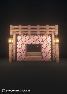 a wooden gate with flowers on it and two lights at the top, in front of a black background