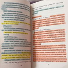 an open book with colorful text on it