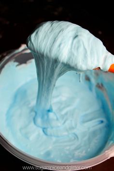 a bowl filled with blue and white frosting