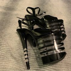 Hi, I’m Selling A Pair Of 8 Inch Size 8 Brand New Black Patent Pleaser Sandals. These Have A Unique Platform And Heel Design And Are A Discontinued/Hard To Find Style. These Have Been Tried On But Never Danced In. I Have Other Pleasers For Sale Too Elegant Black Strapped Heels, Strapped Platform Sandals For Party, Chic Black Strapped Sandals, Elegant Black Strapped Sandals, Strapped Black Heels For Party, Black Strapped Heels For Party, Formal Black Strapped Sandals, Black Strapped Synthetic Heels, Chic Black Strapped Heels