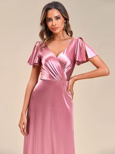 Elevate your evening look with this stunning Ruffles Sleeve A-Line Pleated Satin Back V-Neck Evening Dress. Its sophisticated design, featuring ruffled sleeves and a pleated A-line skirt, exudes elegance and class. The satin back fabric adds a touch of luxury, making it perfect for formal occasions. Whether attending a gala or a cocktail party, this dress is sure to turn heads. Fit: Please refer to size chart. Length: Floor length. Sleeve Style: Short sleeves. Closure: It is concealed a zipper u Feminine V-neck Evening Dress For Party, Feminine V-neck Evening Dress For Formal Occasions, V-neck Evening Dress With Ruffles For Wedding Guest, Pink V-neck Dress With Surplice Neckline For Formal Occasions, V-neck Ruffles Evening Dress, Elegant Pink V-neck Dress With Ruffles, Formal V-neck Evening Dress With Ruffles, Feminine V-neck Party Evening Dress, Pink Flutter Sleeve Formal Dress