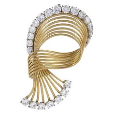 A French 1950's 18 karat gold brooch with diamonds by Cartier. The highly stylized brooch appears to be caught in motion, as a bouquet of gold ribs makes an elegant, diamond-crowned arc before looping back upon itself, ultimately fanning out as it stretches downward, allowing for the significant diamond accents at the bottom of the brooch to each be displayed in full. The brooch has 23 diamonds with an approximate total weight of 3.40 carats. French Control Marks, Makers Mark. Circa 1950's. Sign Vintage Cartier Diamond Jewelry, Cartier Antique Jewelry, Cartier Brooch, Diamond Brooch Cartier, Luxury Vintage Brooches With Diamond Accents, Parisian Jewelry, Cartier Gold, Round Diamond Setting, Diamond Brooch